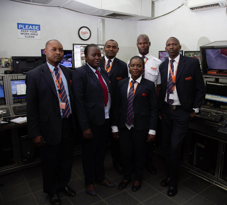 SGA Security personnel posing in office